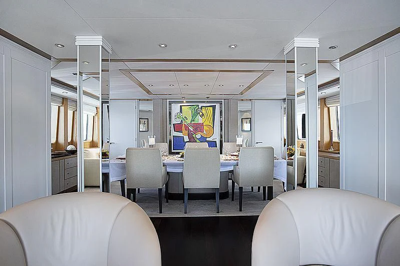 a room with chairs and a table aboard DEEP BLUE II Yacht for Charter