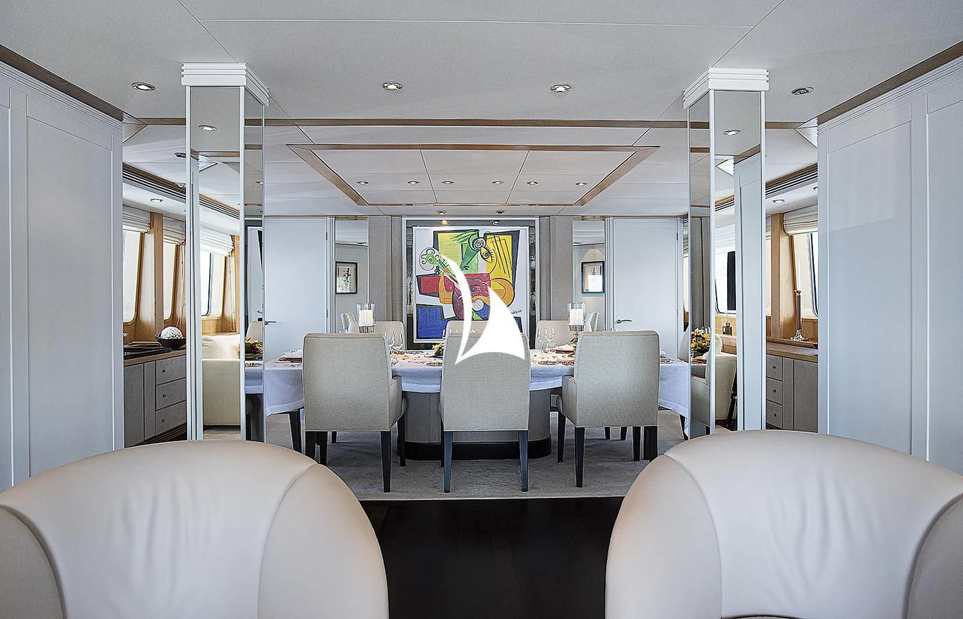 a room with chairs and tables aboard DEEP BLUE II Yacht for Charter