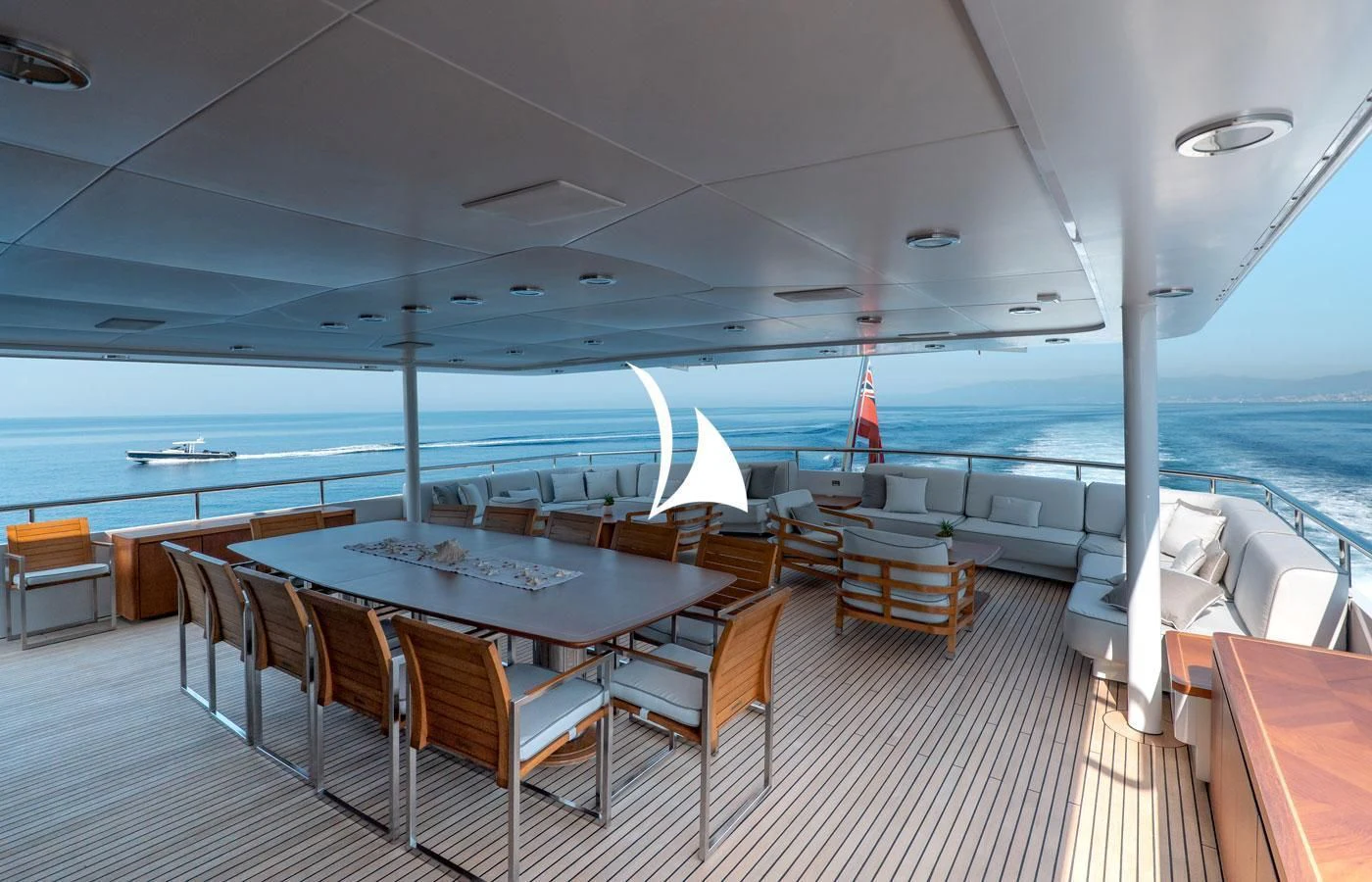 a table and chairs on a boat aboard DEEP BLUE II Yacht for Charter