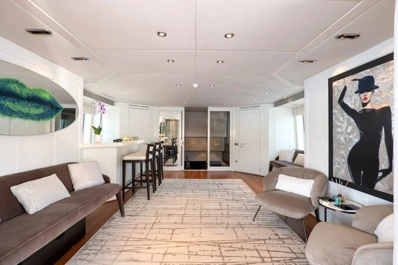 a living room with a large screen aboard DEEP BLUE II Yacht for Charter