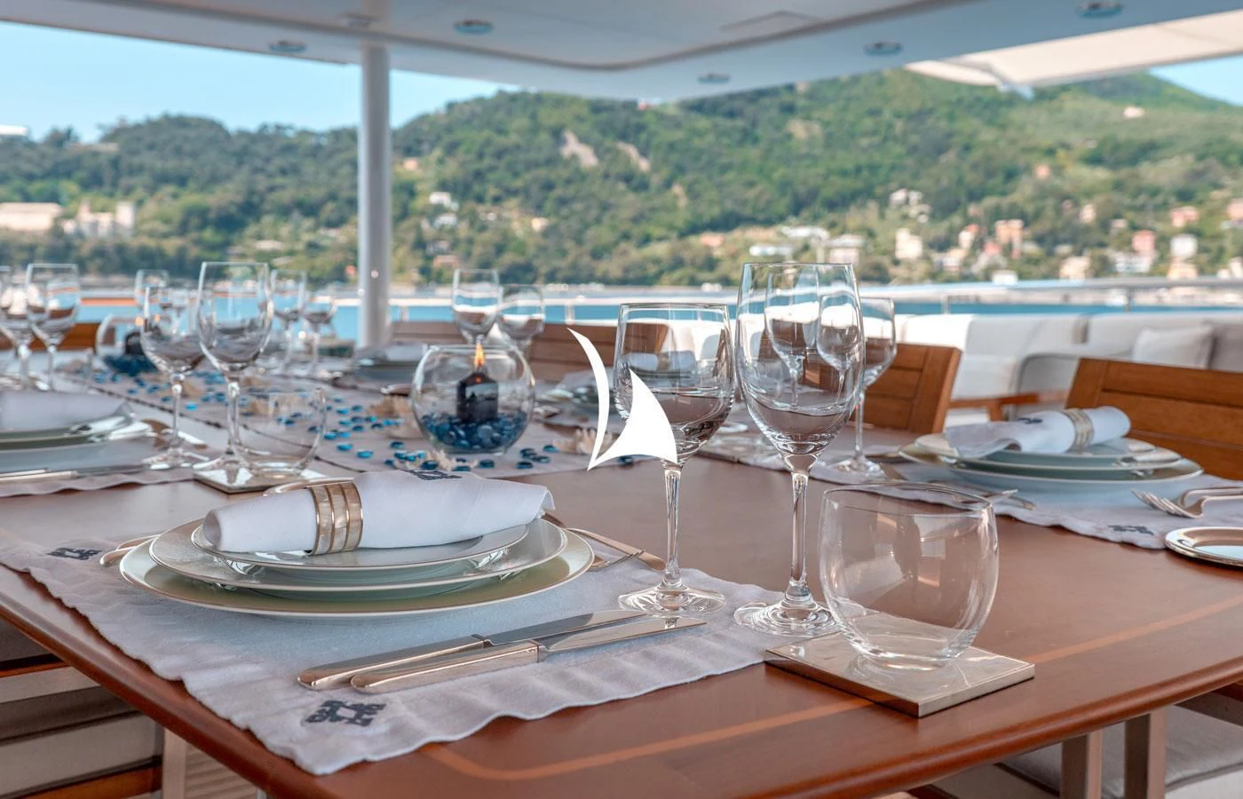a table with plates and glasses on it aboard DEEP BLUE II Yacht for Charter