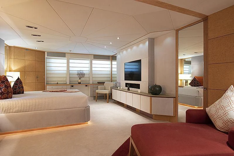 a room with a bed and a tv aboard DEEP BLUE II Yacht for Charter