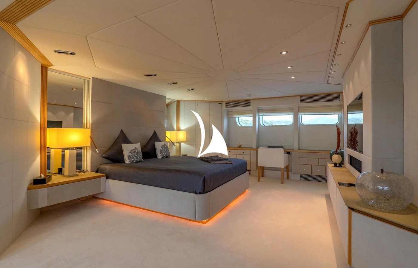 a large bedroom with a large bed aboard DEEP BLUE II Yacht for Charter