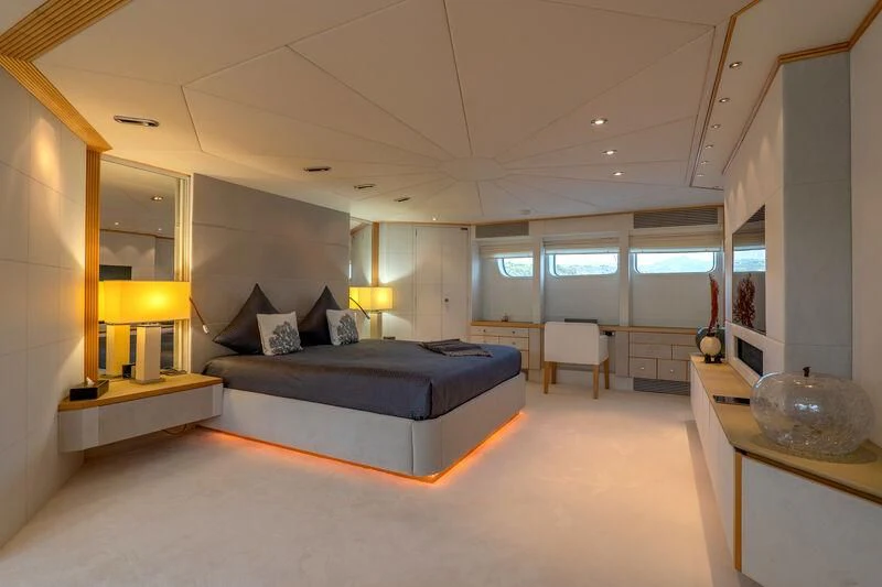 a large bedroom with a large bed aboard DEEP BLUE II Yacht for Charter