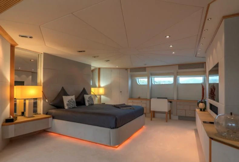 a large bedroom with a large bed aboard DEEP BLUE II Yacht for Charter