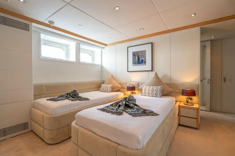 a couple of beds in a room aboard DEEP BLUE II Yacht for Charter