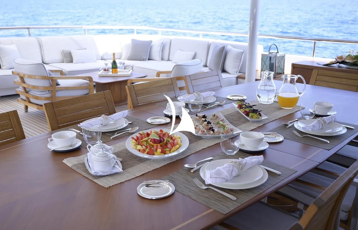 a table with plates and glasses on it aboard DEEP BLUE II Yacht for Charter