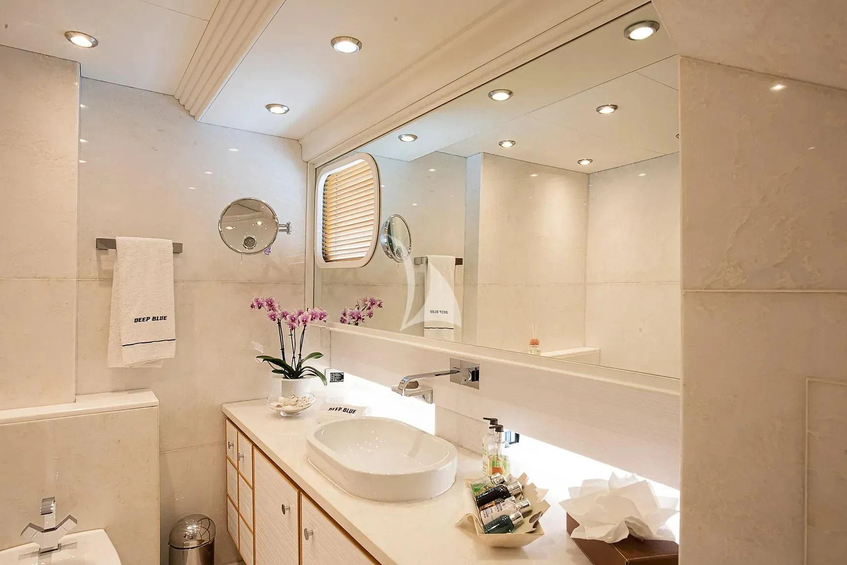 a bathroom with a large mirror aboard DEEP BLUE II Yacht for Charter