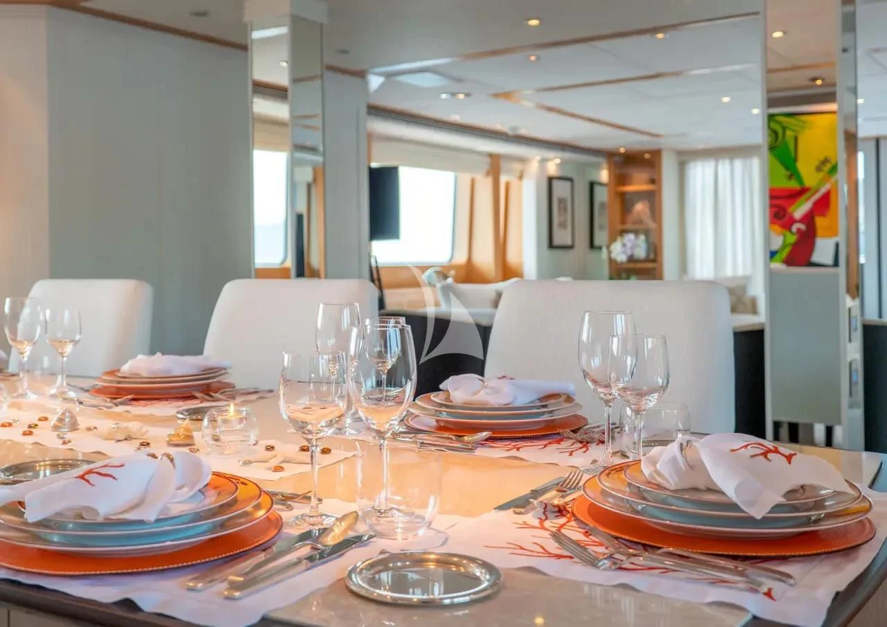 a table with plates and glasses on it aboard DEEP BLUE II Yacht for Charter