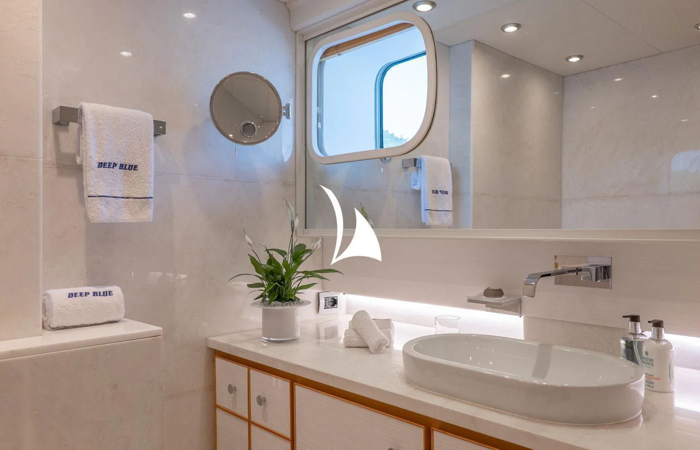 a bathroom with a large mirror aboard DEEP BLUE II Yacht for Charter