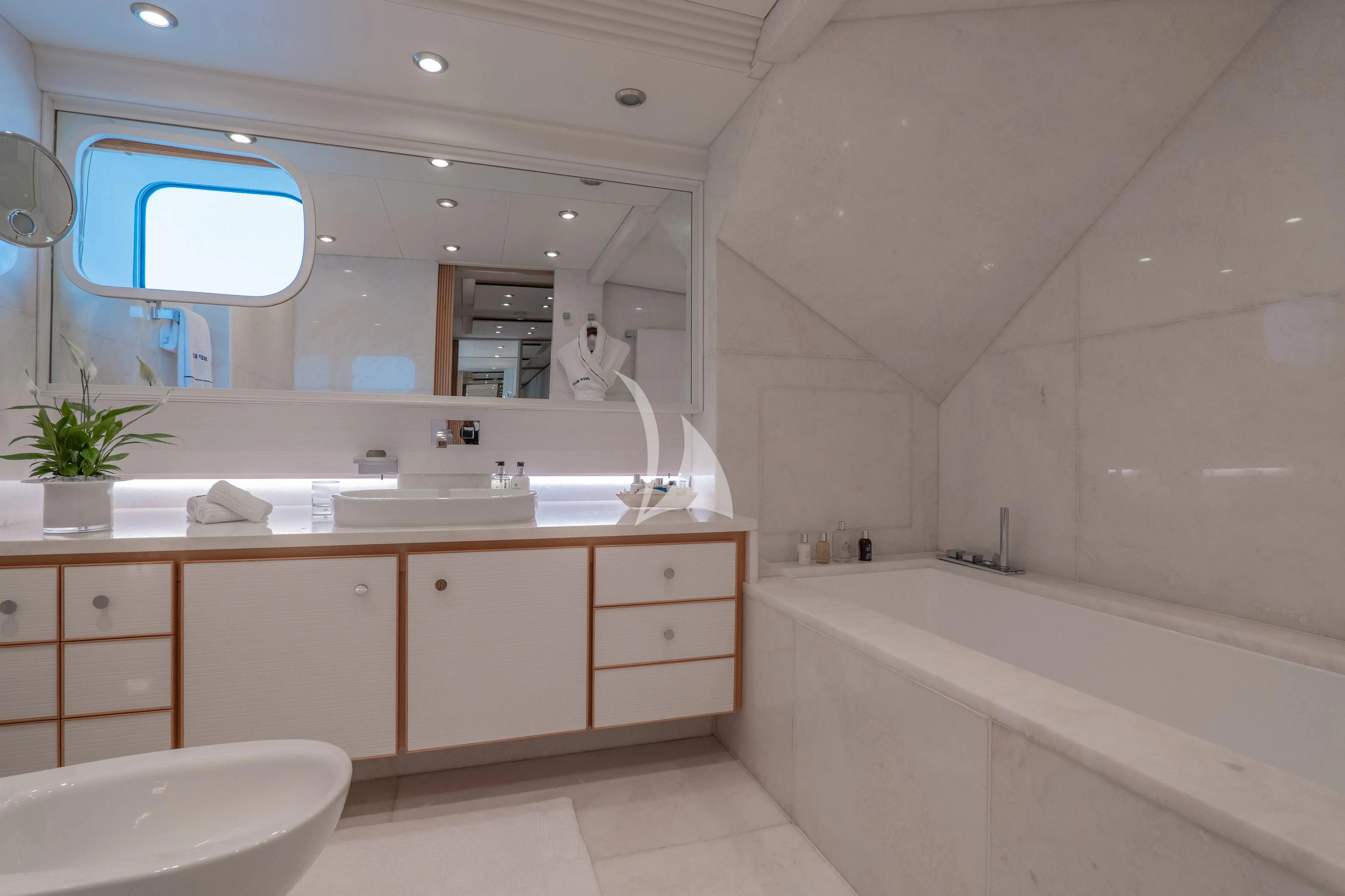 a bathroom with a large mirror aboard DEEP BLUE II Yacht for Charter