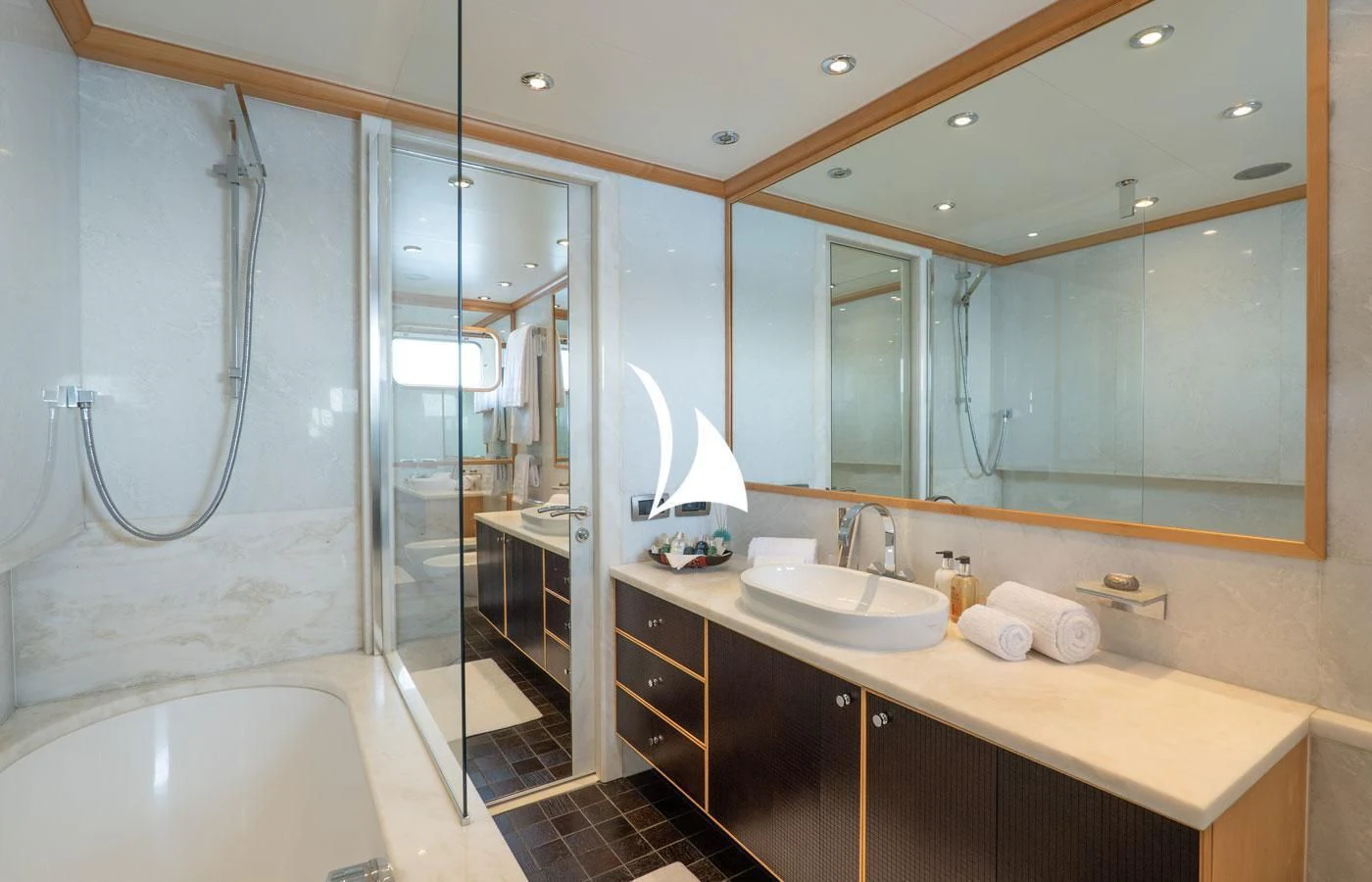 a bathroom with a glass shower aboard DEEP BLUE II Yacht for Charter
