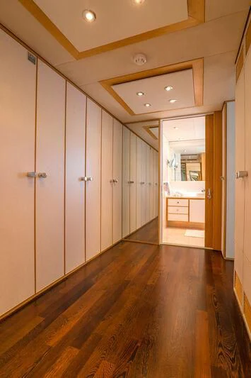 a hallway with white doors aboard DEEP BLUE II Yacht for Charter