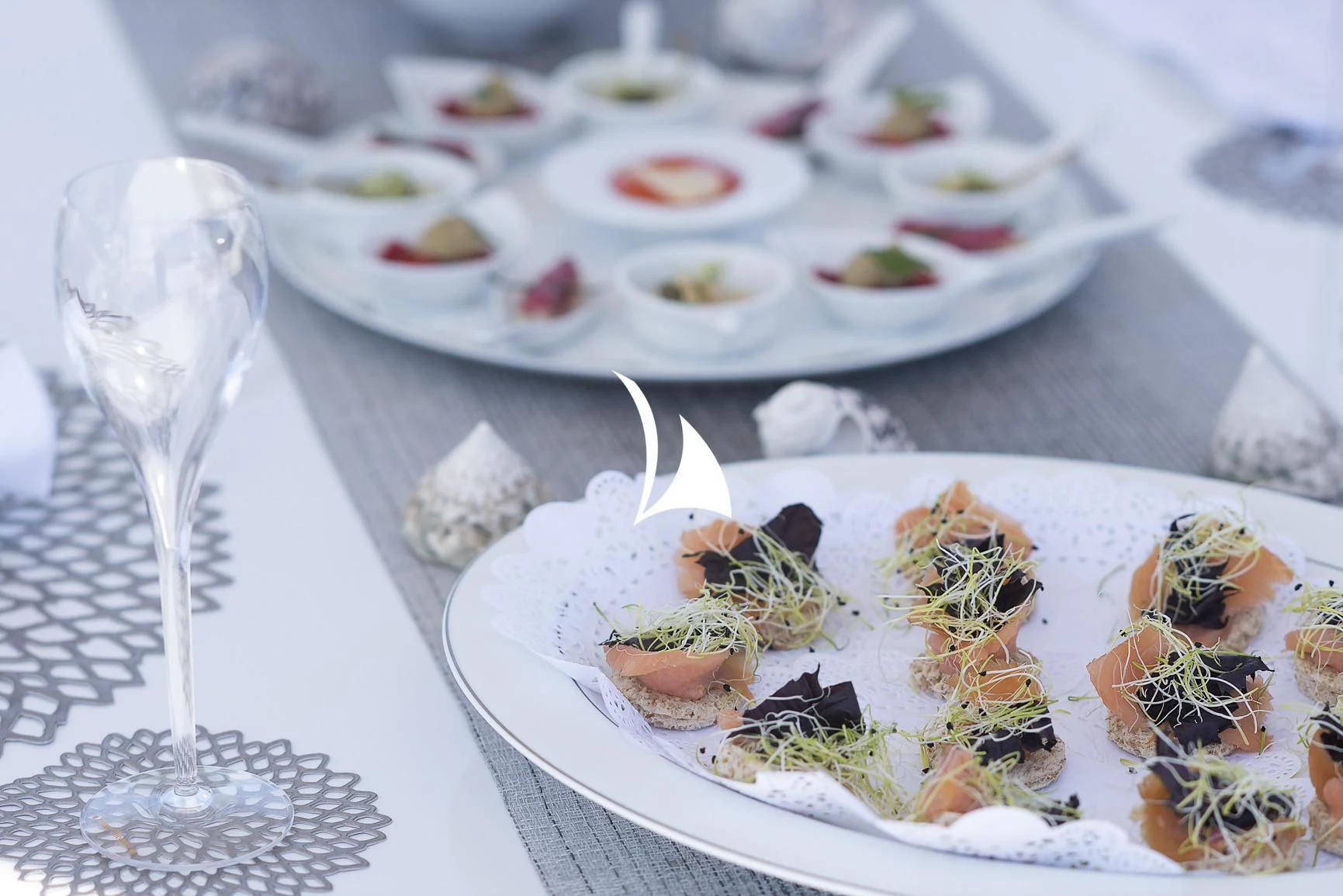 a table with plates of food aboard DEEP BLUE II Yacht for Charter