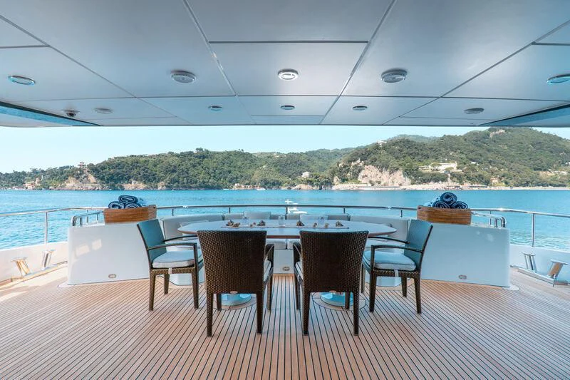 a table and chairs on a deck aboard DEEP BLUE II Yacht for Charter