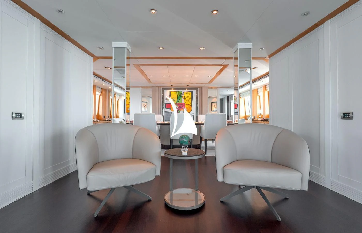 a room with chairs and a table aboard DEEP BLUE II Yacht for Charter
