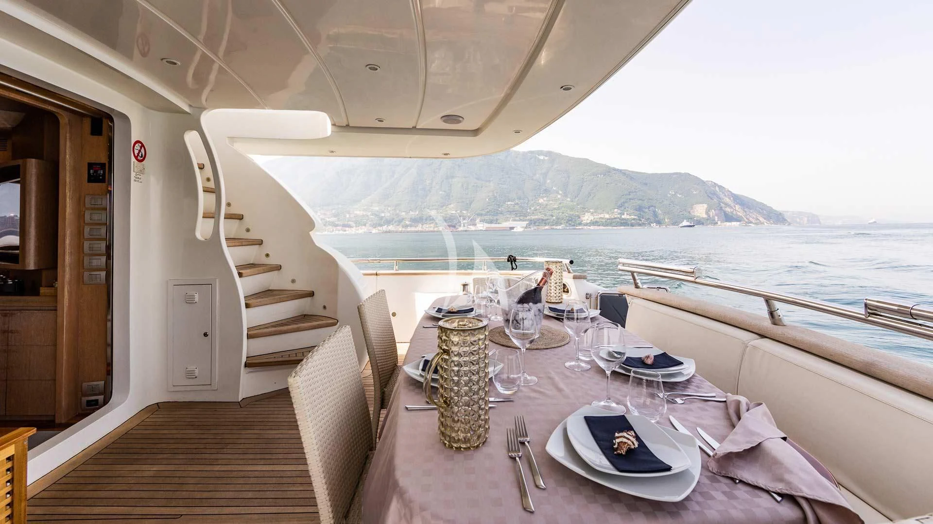a dining table on a boat aboard DUBAI Yacht for Sale