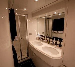 a bathroom with a large mirror aboard DUBAI Yacht for Sale
