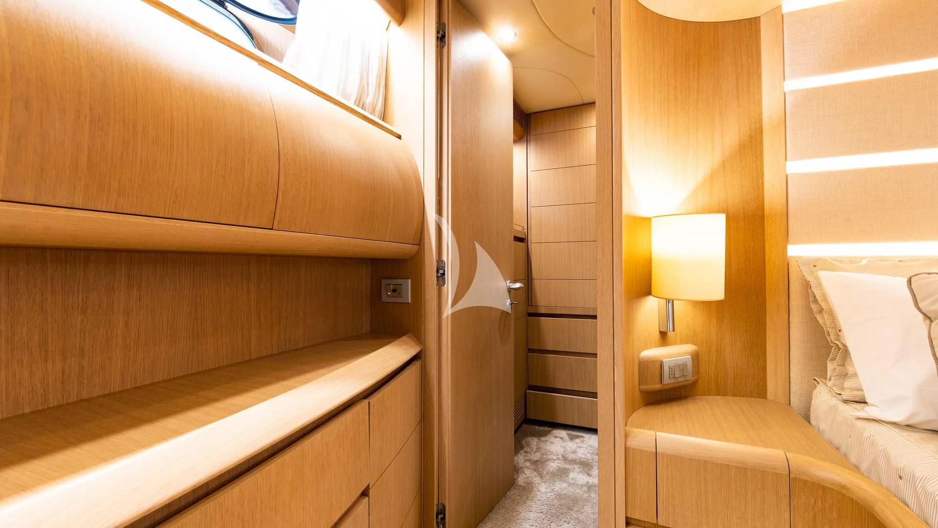 a room with a bed and a lamp aboard DUBAI Yacht for Sale