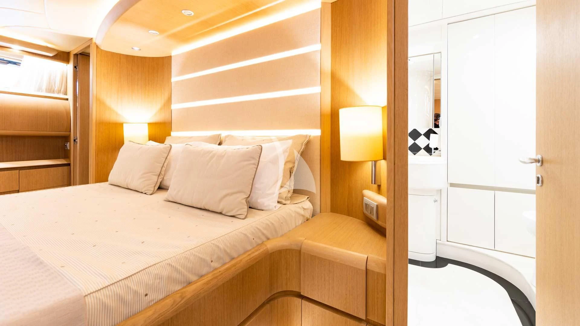 a bed with white sheets aboard DUBAI Yacht for Sale
