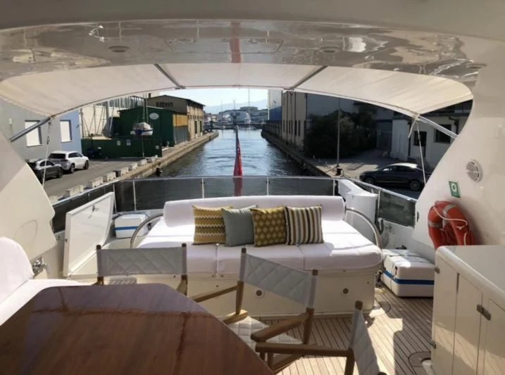 a room with a pool table and chairs aboard DUBAI Yacht for Sale