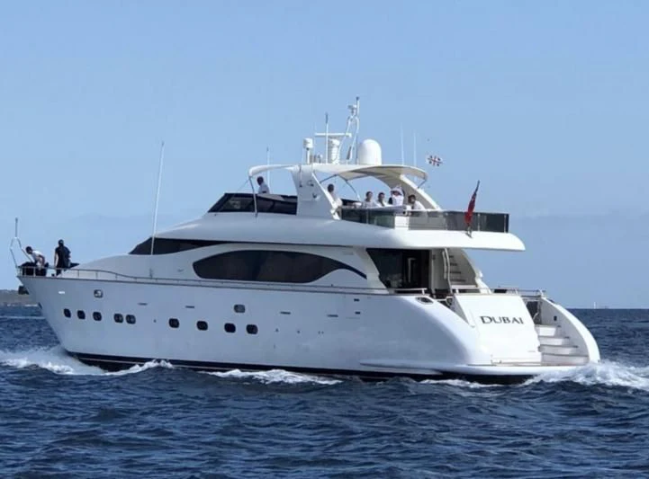 a white boat on the water aboard DUBAI Yacht for Sale
