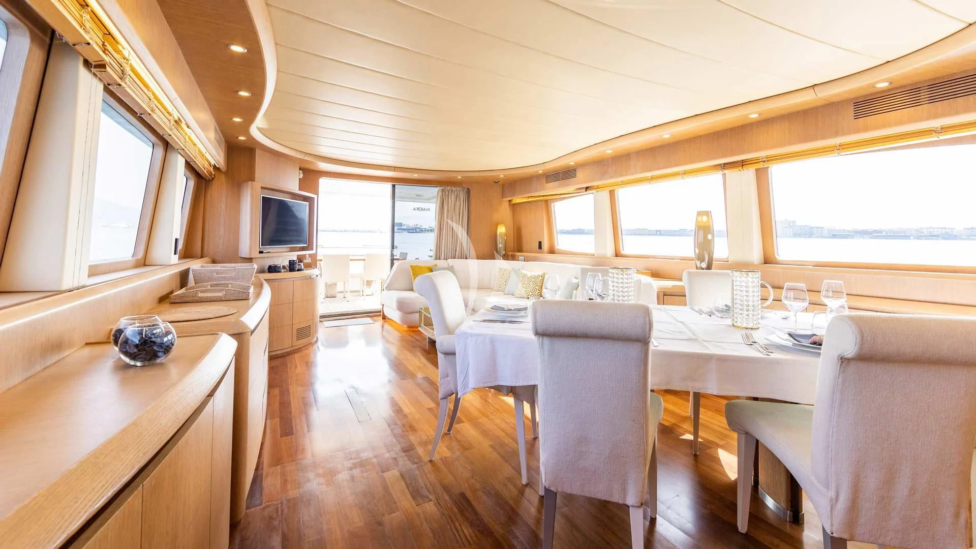 a large dining table in a room aboard DUBAI Yacht for Sale