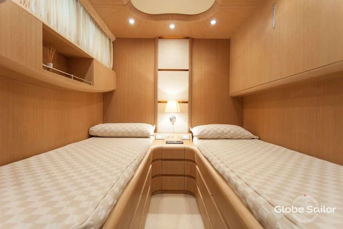 a room with two beds aboard DUBAI Yacht for Sale