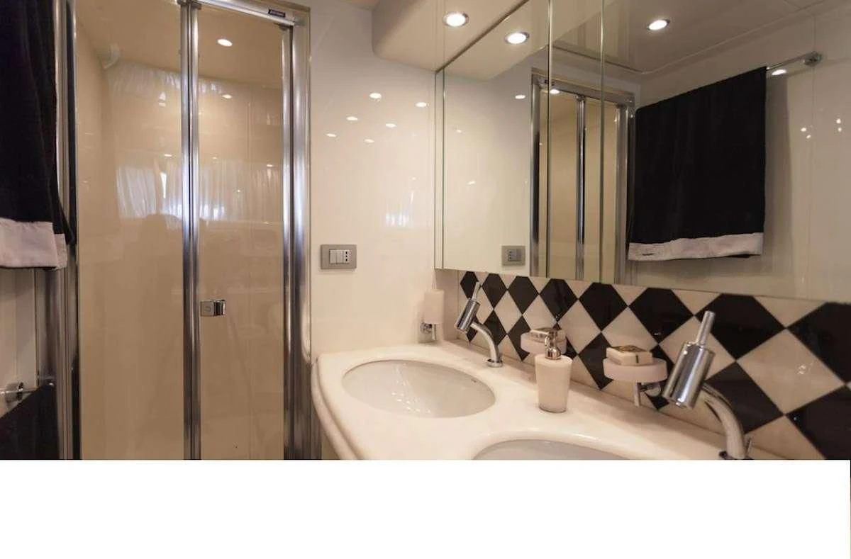 a bathroom with a sink and a shower aboard DUBAI Yacht for Sale