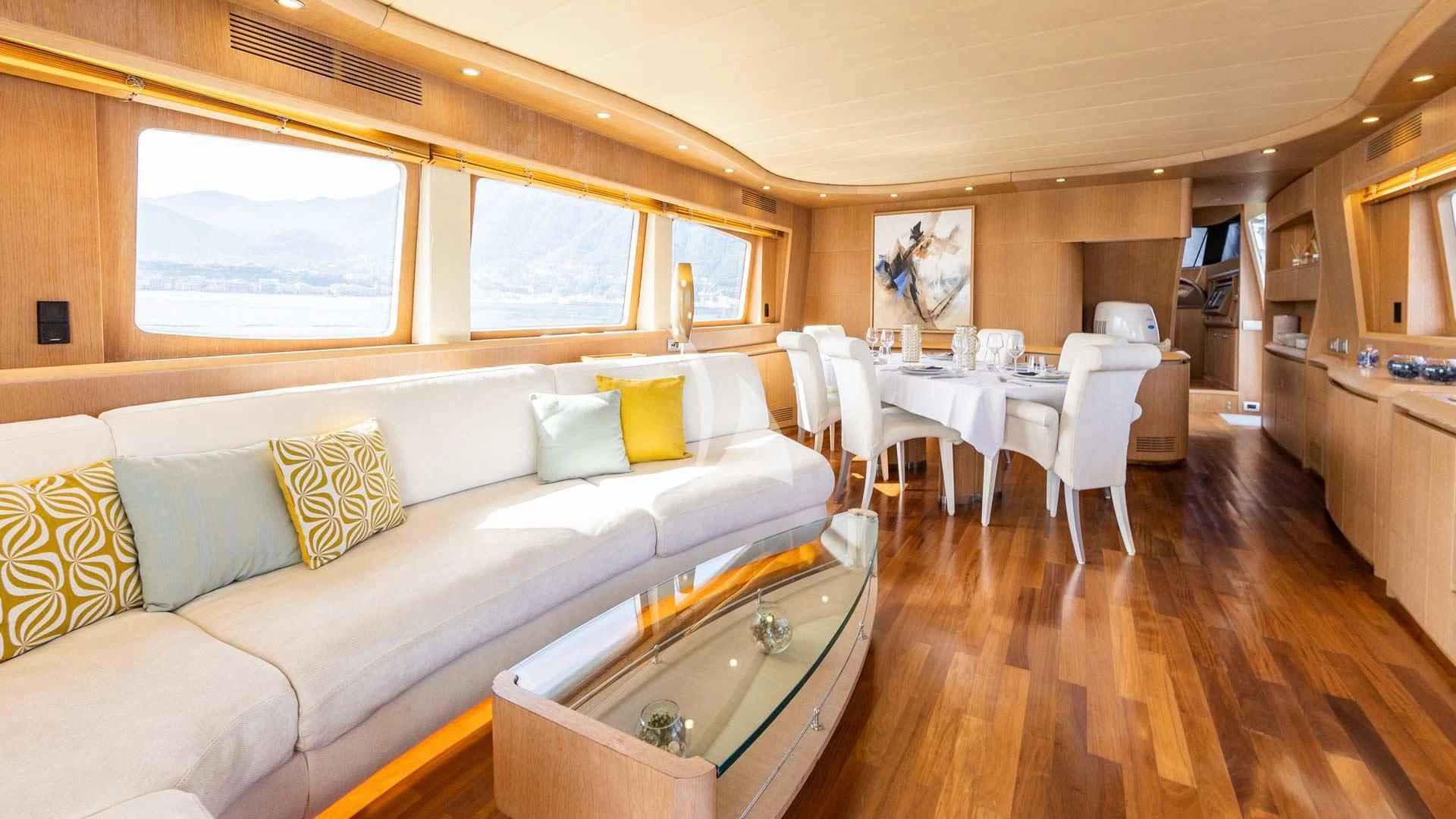 a living room with a couch and a table aboard DUBAI Yacht for Sale