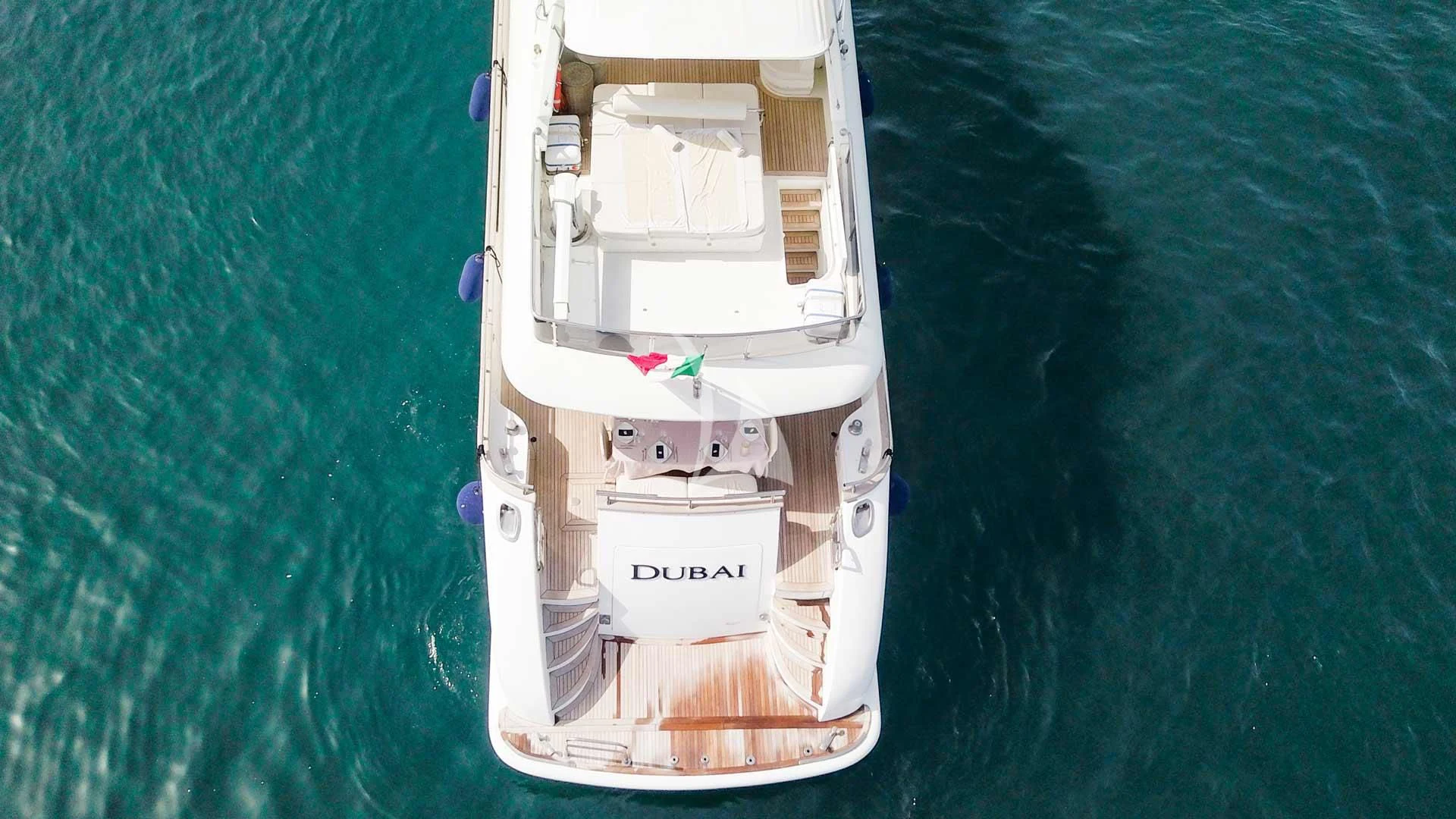 a white boat on the water aboard DUBAI Yacht for Sale