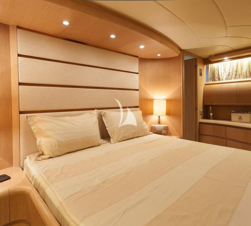 a bed with white sheets aboard DUBAI Yacht for Sale