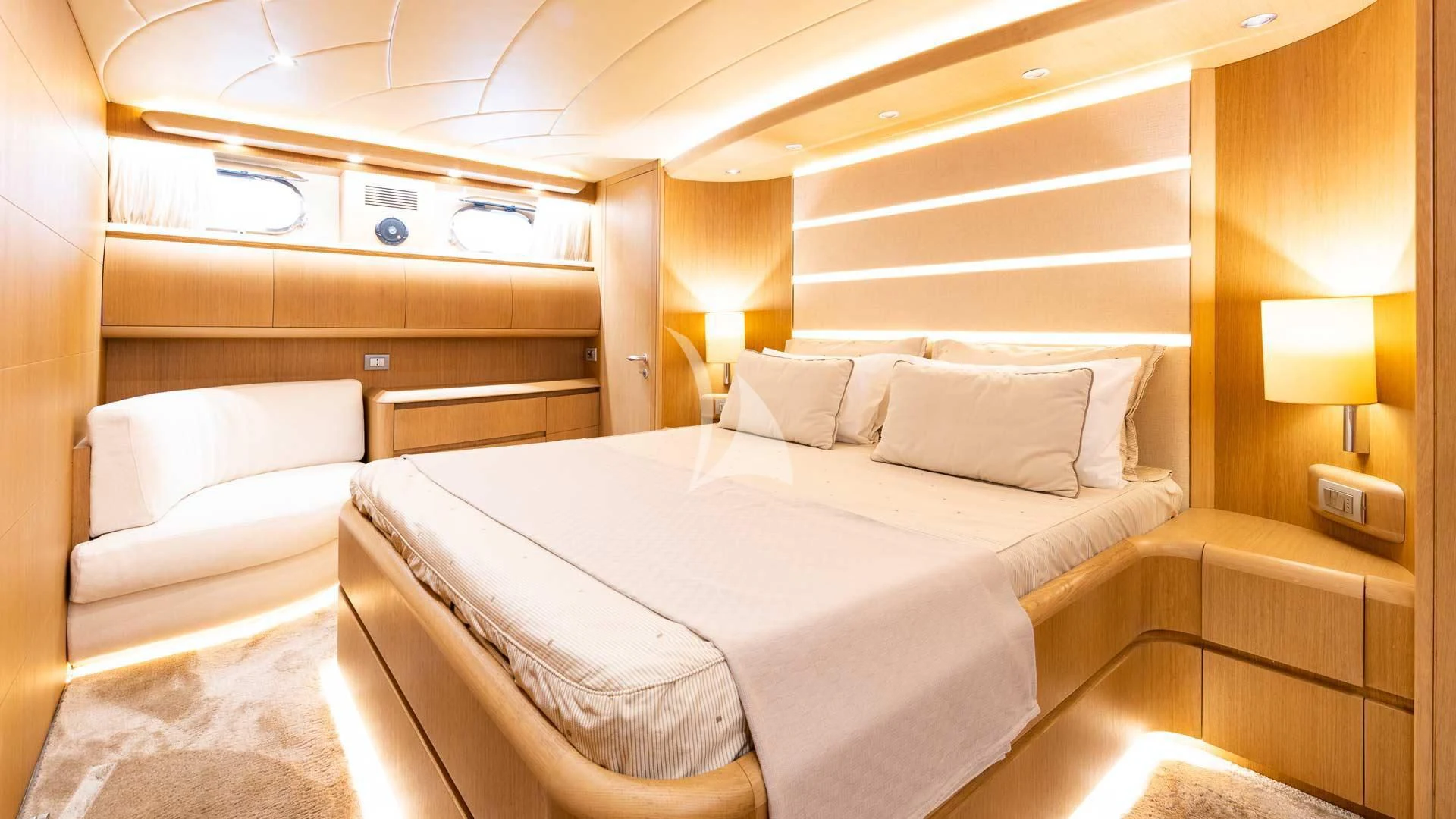a room with a bed and a lamp aboard DUBAI Yacht for Sale