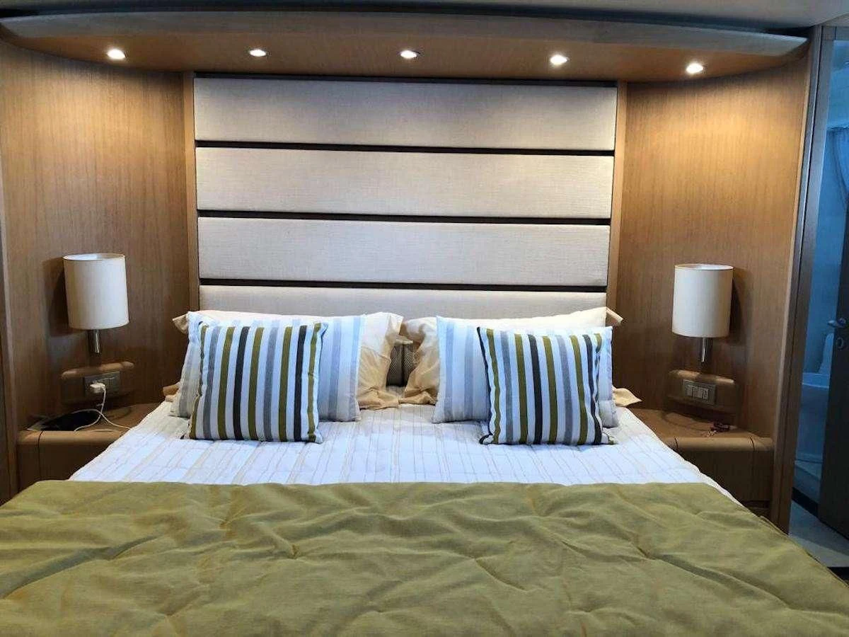 a bed with a pillow and pillows aboard DUBAI Yacht for Sale