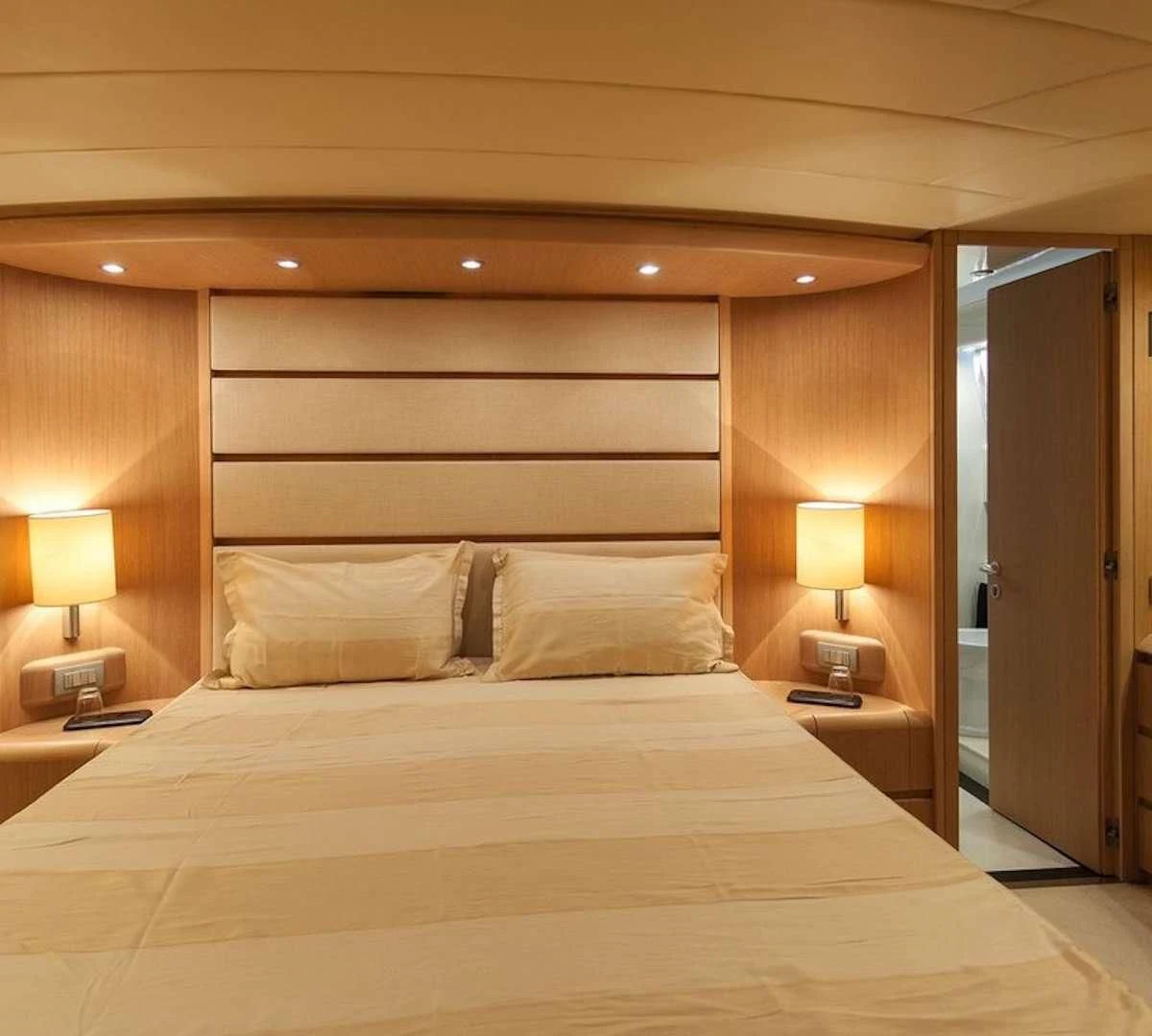 a bed with a white sheet and pillows aboard DUBAI Yacht for Sale