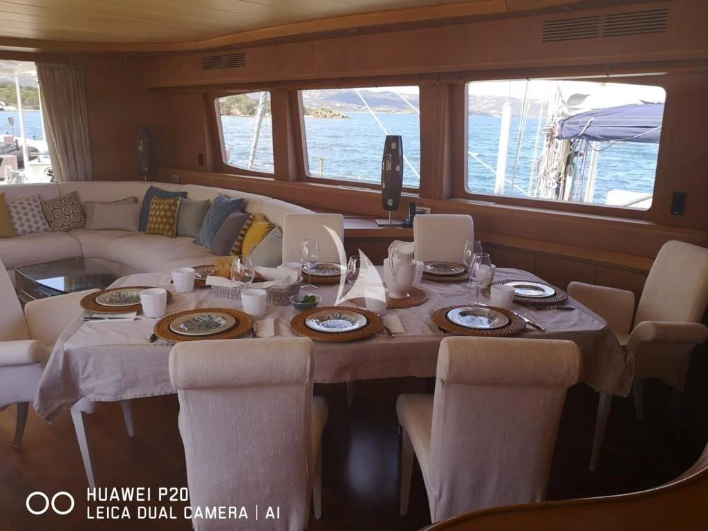 a dining table set for a family dinner aboard DUBAI Yacht for Sale