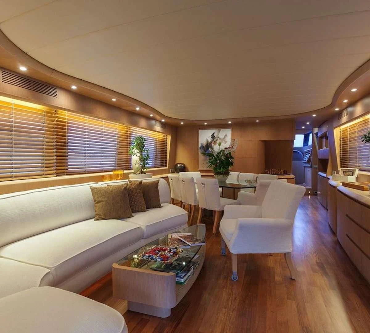 a living room with a couch and a coffee table aboard DUBAI Yacht for Sale