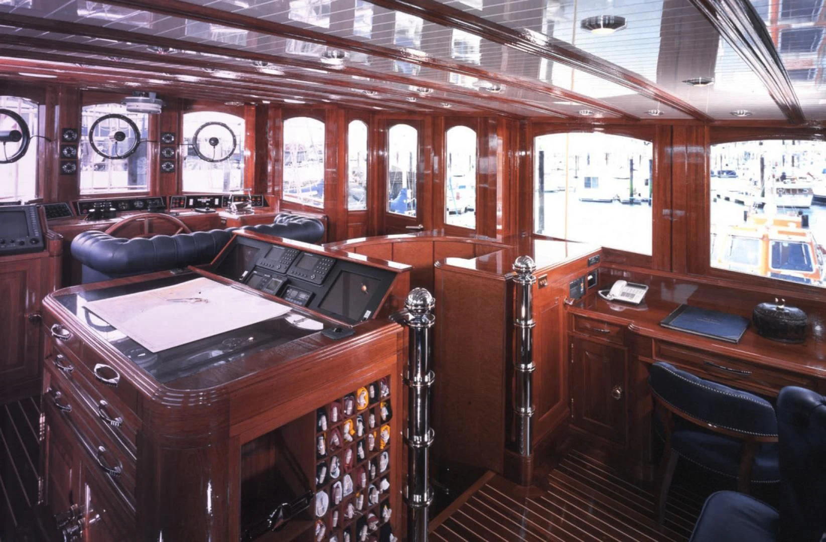 a room with a desk and a chair aboard ATLANTIDE Yacht for Sale