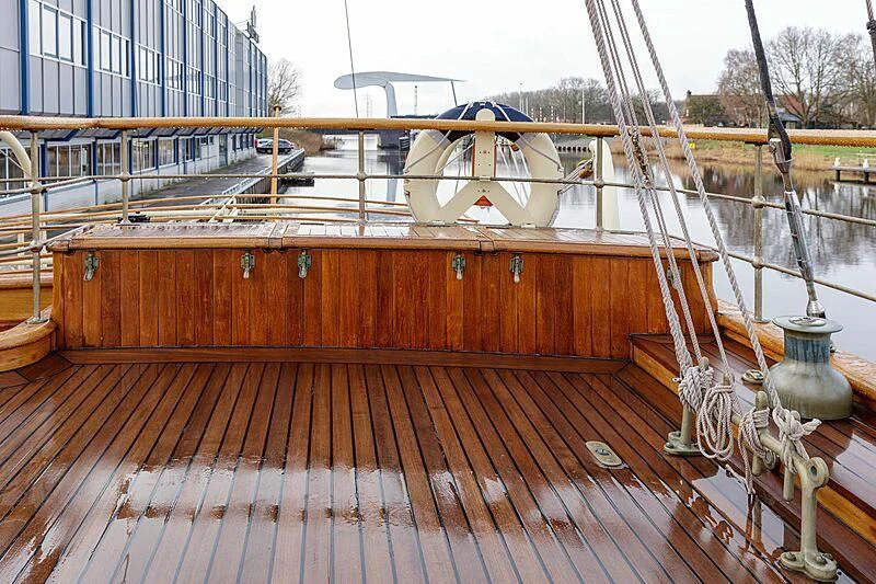 a wooden deck with a water fountain aboard ATLANTIDE Yacht for Sale