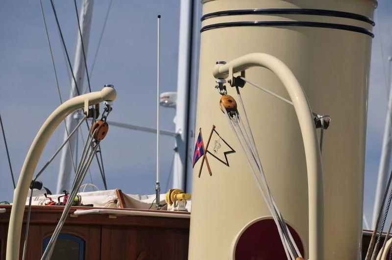 a boat with a flag on the front aboard ATLANTIDE Yacht for Sale