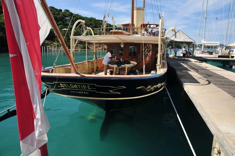 a boat docked at a pier aboard ATLANTIDE Yacht for Sale