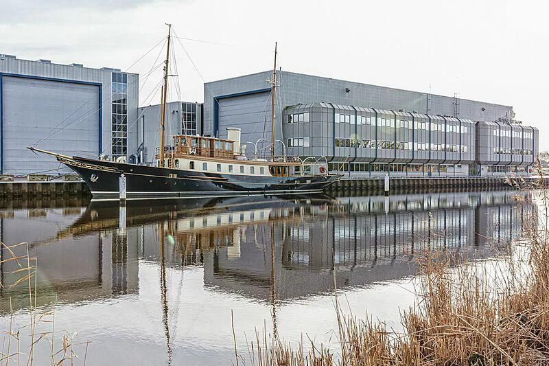 a body of water with a boat and buildings in the background aboard ATLANTIDE Yacht for Sale