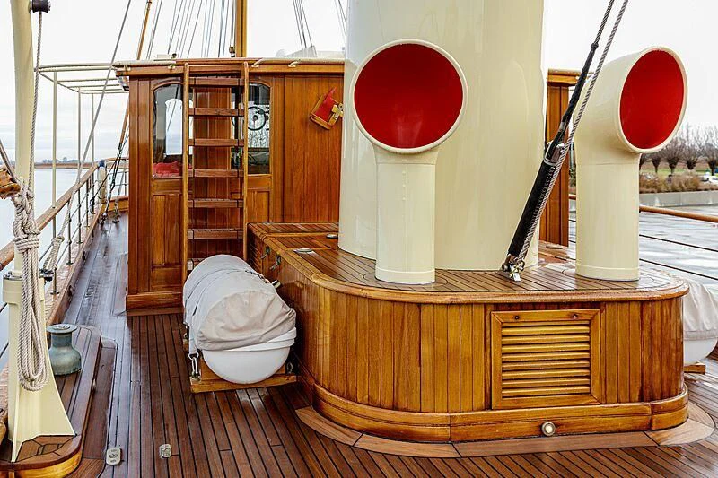 a wooden box with a red balloon in the back aboard ATLANTIDE Yacht for Sale