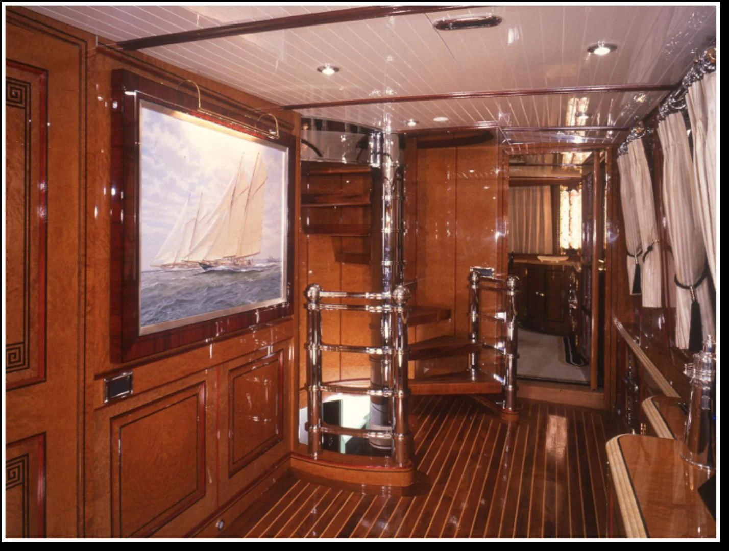 a room with wooden furniture aboard ATLANTIDE Yacht for Sale
