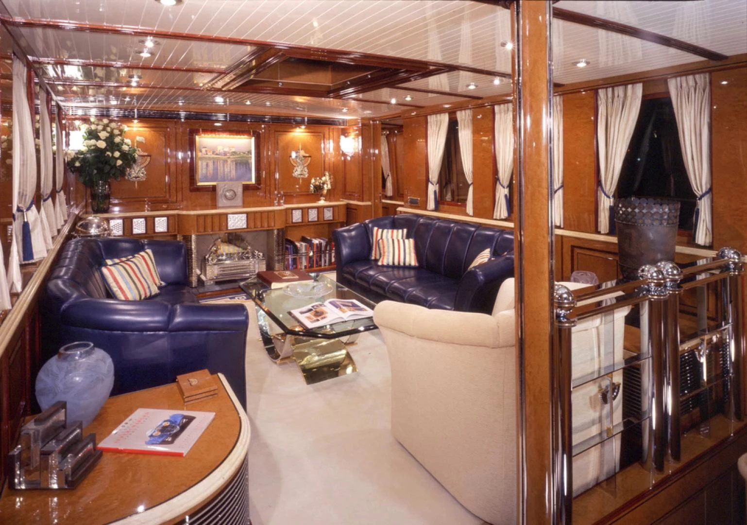 a living room with a leather couch aboard ATLANTIDE Yacht for Sale