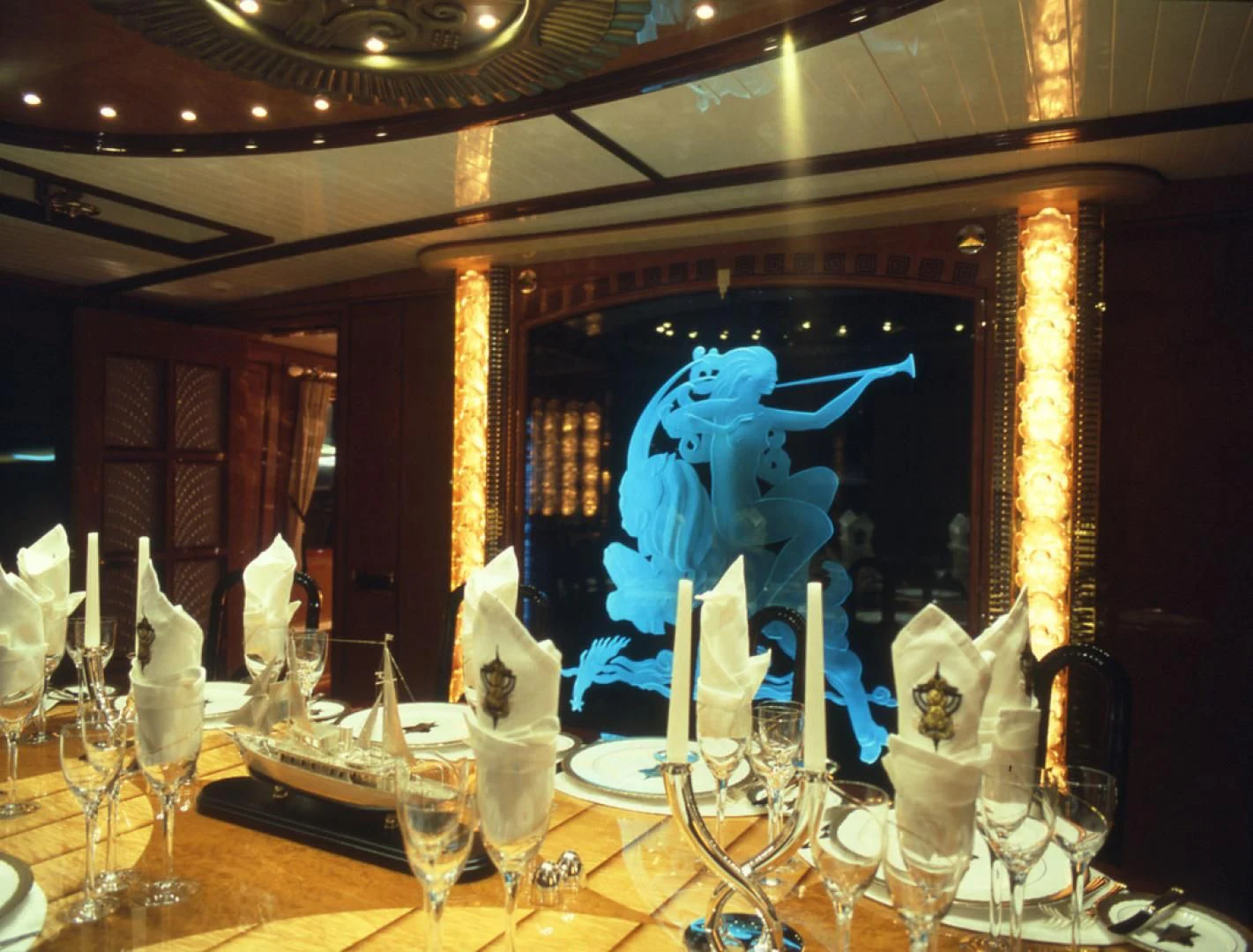 a blue dragon statue on a table aboard ATLANTIDE Yacht for Sale