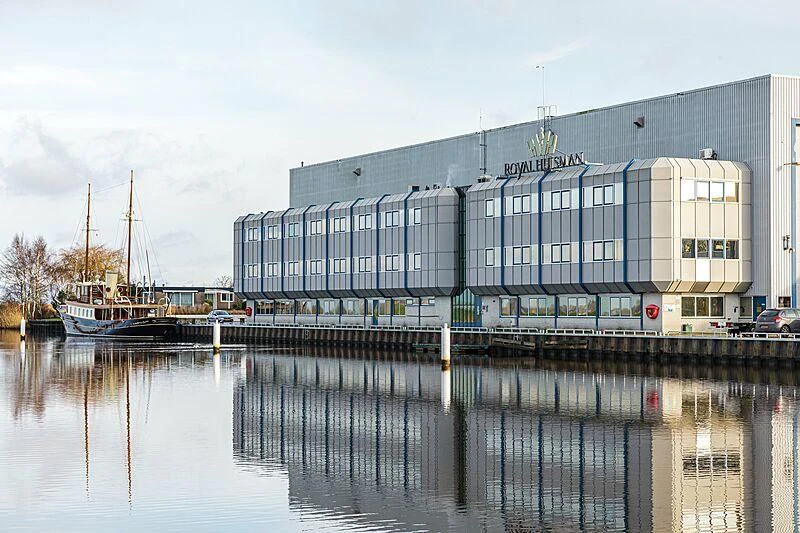 a building next to a body of water aboard ATLANTIDE Yacht for Sale