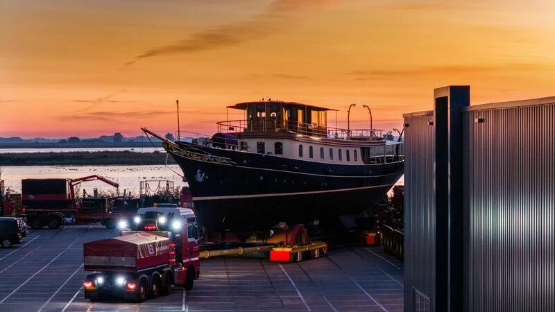 a large boat docked at a port aboard ATLANTIDE Yacht for Sale