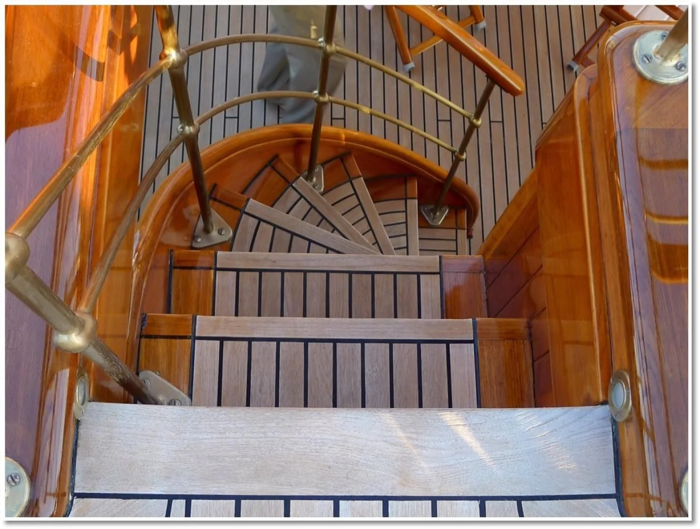 a staircase with a spiral staircase aboard ATLANTIDE Yacht for Sale