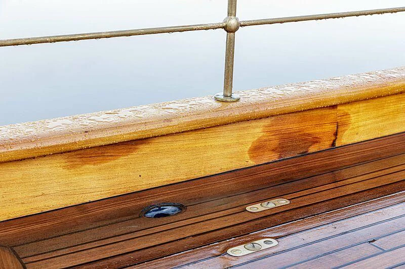 a wooden surface with a screw aboard ATLANTIDE Yacht for Sale